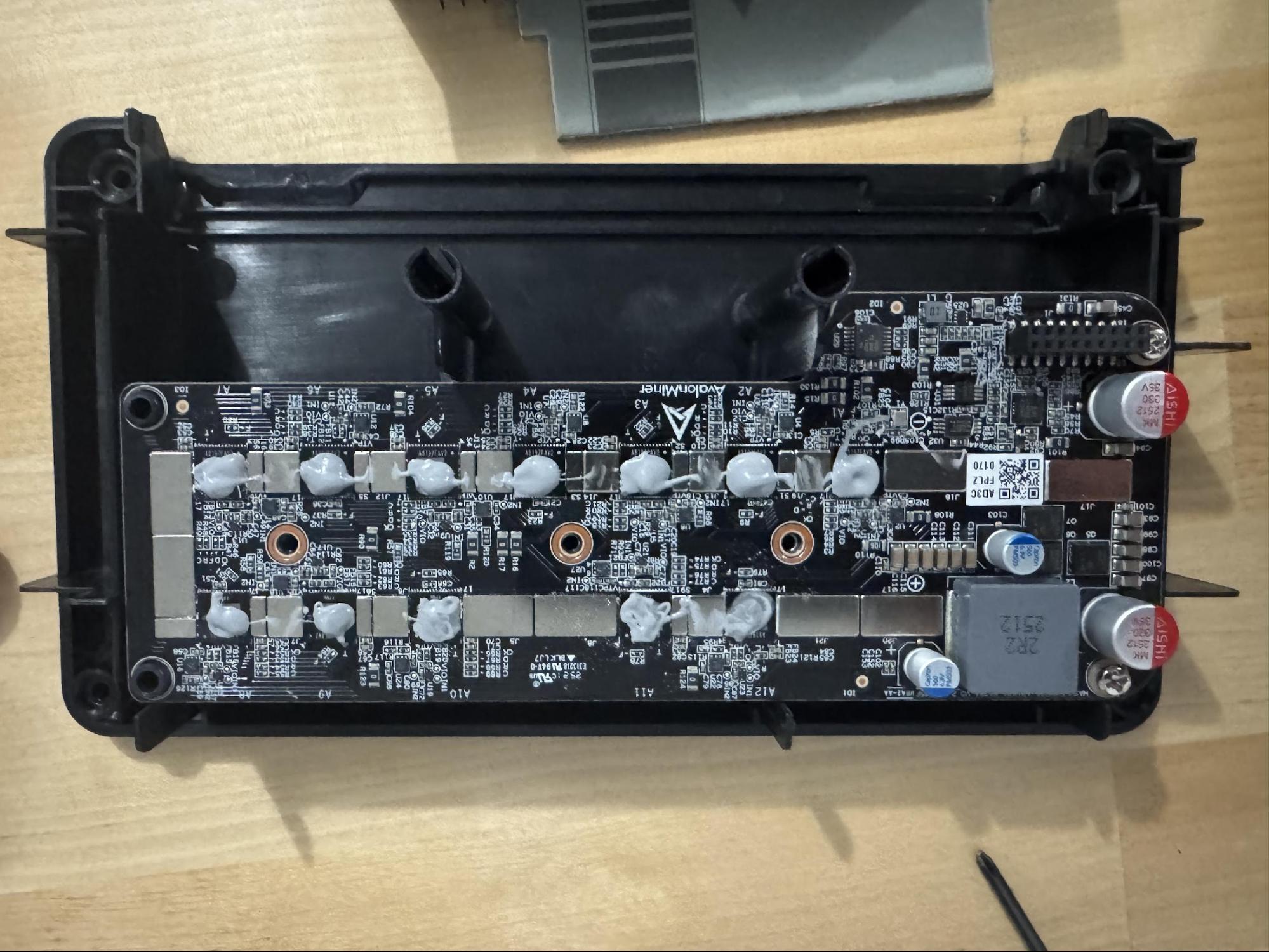 All 12 ASIC chips freshly pasted with small dots of Arctic MX-4 thermal paste.