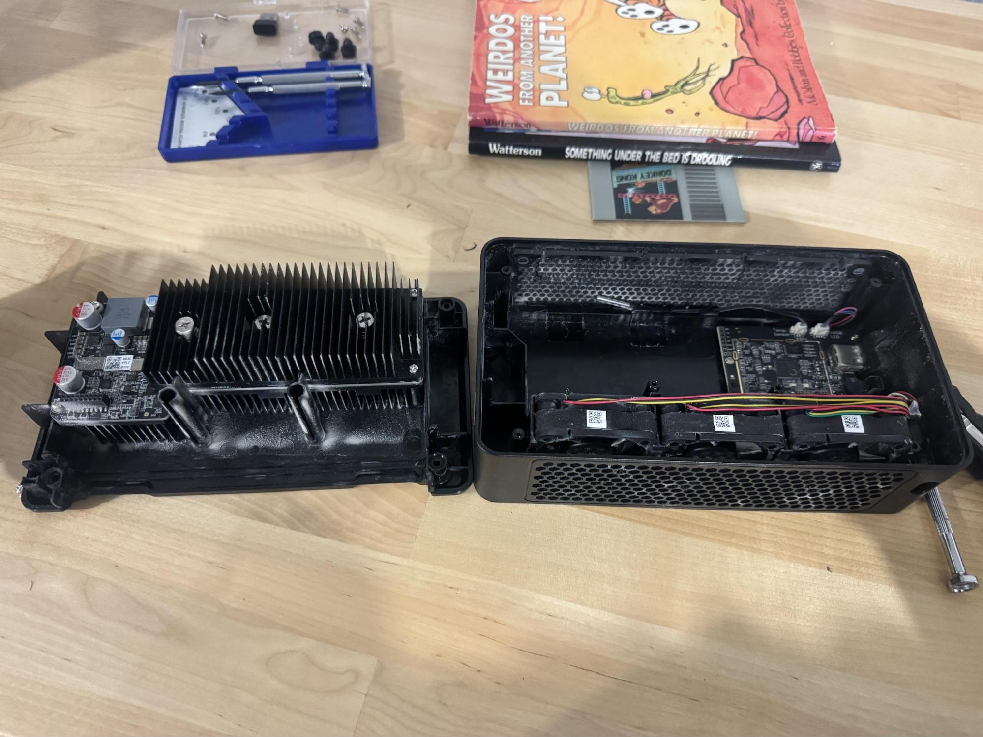 The Nano3s opened showing heatsink/hashboard assembly on the left and chassis shell with fans on the right.